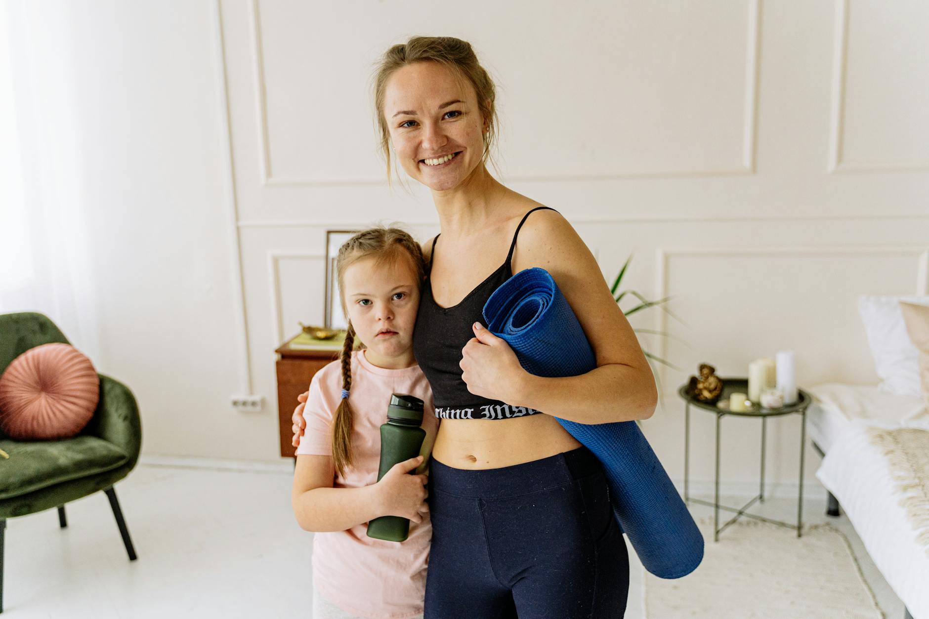 A modern family shares a moment indoors, bonding together while wearing face masks.